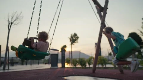 Little boy having fun on chain swing. The simple joys of childhood. Stock Footage 207844349