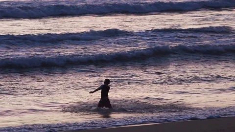 Little boy having fun in ocean waves 스톡 동영상 83699655