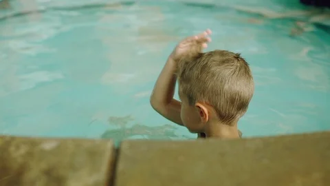 Little boy having fun in the pool Video stock 123979281