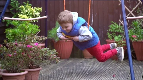 Little boy having fun on the swing Stock-Footage 80238007