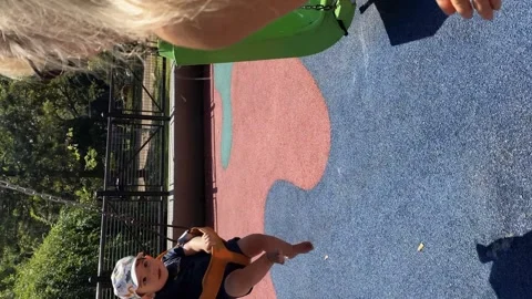 Little boy having fun on the swing with his grandmother. Stock Footage 254536182