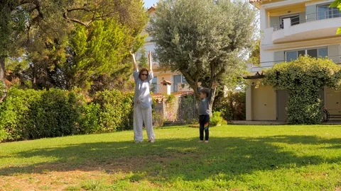 Little boy having fun while visiting grandmother. Healthy lifestyle concept Stock Footage 113673152