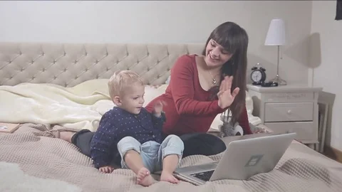 Little boy is having video conversation. FULL HD. flare Stock Footage 73970597