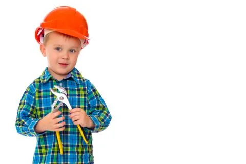 The little boy in the helmet of the builder. Stock Photos
