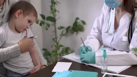 Little boy with his dad is visiting the pediatrician's office Stock Footage 194465842