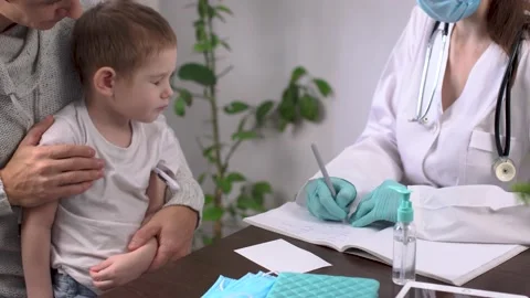 Little boy with his dad is visiting the pediatrician's office Stock Footage 194465861
