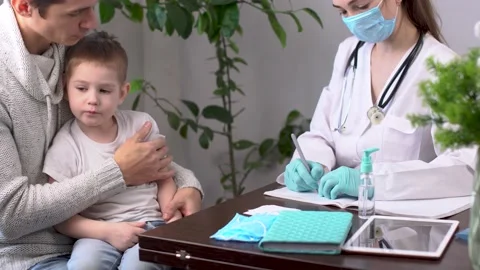Little boy with his dad is visiting the pediatrician's office Stock Footage 194465984
