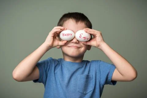 A little boy holding a Easter eggs Stock Photos
