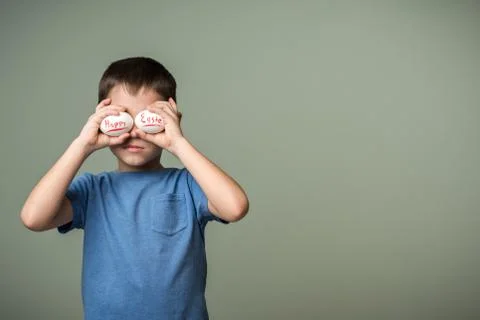 A little boy holding a Easter eggs Stock Photos