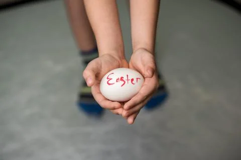 A little boy holding a Easter eggs Stock Photos