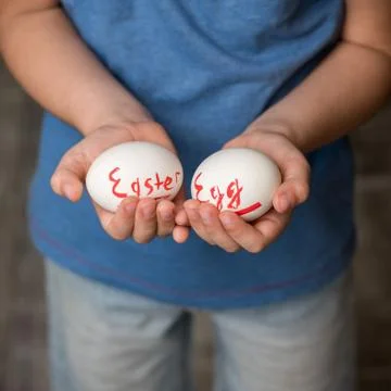 A little boy holding a Easter eggs Stock Photos