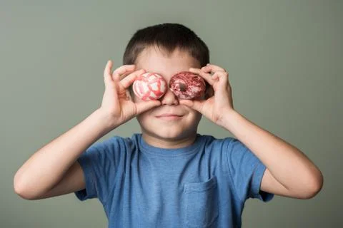 A little boy holding a Easter eggs Stock Photos