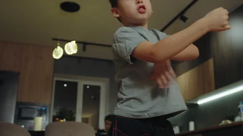 Little boy imagining that he is beating someone, gesticulating and talking Stock Footage 273306311