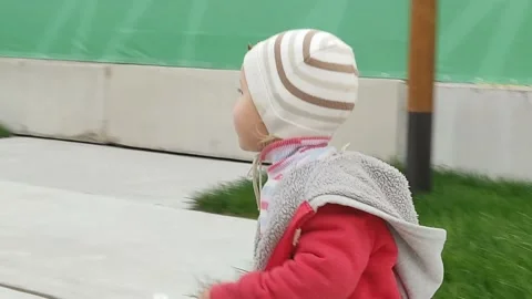 A little boy inflates soap bubbles and catches up when they fly away Stock Footage 160337454