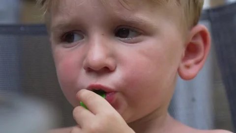 Little boy  inflating a balloon Stock Footage 81187158