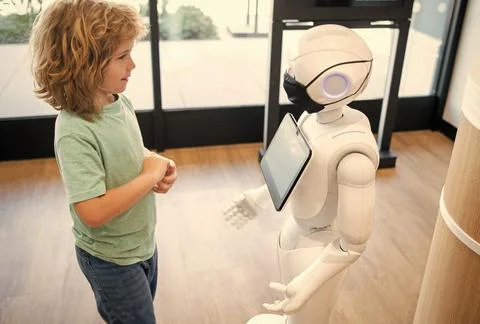 Little boy interact with robot artificial intelligence, interaction Stock Photos