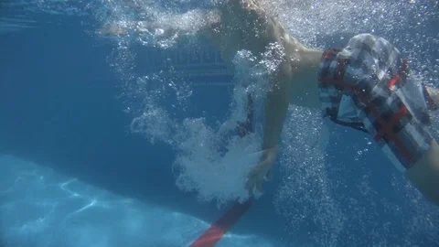 Little boy jumping and diving in Swimming Pool 4K Stock Footage 84000455