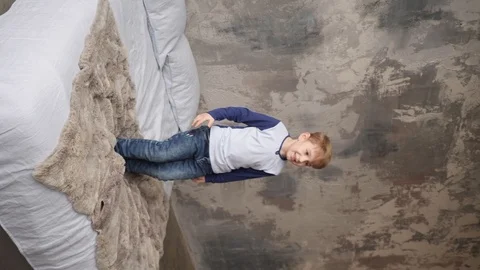 Little boy jumping on a bed Video stock 91823327