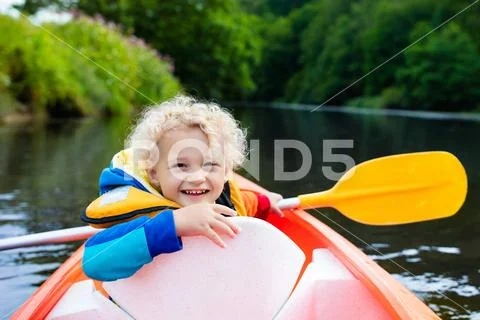 Little boy in kayak Stock Photos