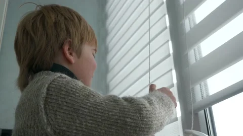 Little Boy Kid Opens Window Roller Shutter Blinds Curtain. Cute Child at Home 4K Stock Footage 171656783