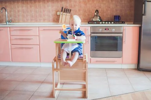 Little boy in kitchen Stock Photos