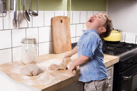 Little boy in the kitchen Stock Photos