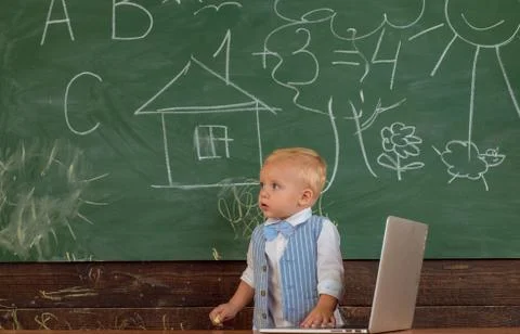 Little boy with laptop in computer class. Laptop user learn new technology in 스톡 사진