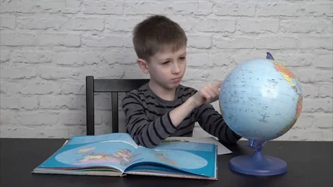 Little boy learning geography Video stock 69217117