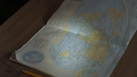 Little boy learning geography - looking at maps and the globe Stock Footage 69787867