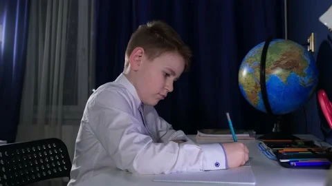 Little boy is learning lessons in his room 스톡 동영상 169307358