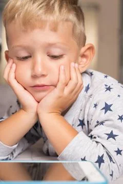 Little boy learning using digital tablet close up Stock Photos