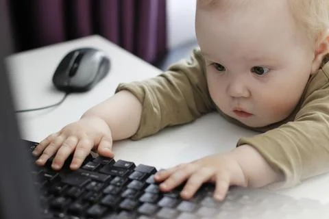 Little boy with light work on the computer. high quality Stock Photos