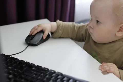Little boy with light work on the computer. high quality Stock Photos