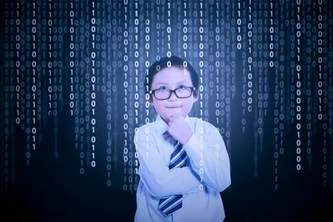 Little boy looking at binary code Foto stock