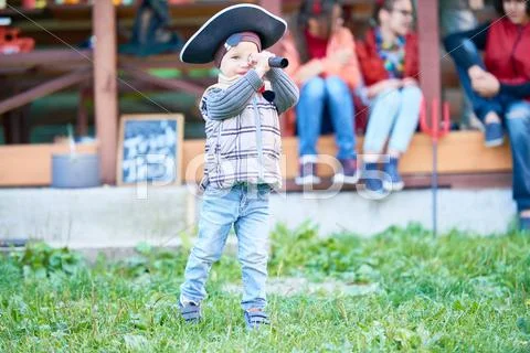 Little boy looking in binoculars Stock Photos