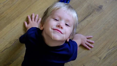 Little boy looking at camera and smiling, top view Stock Footage 96192105