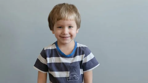 Little boy looking at camera and smiling Stock Footage 104149466