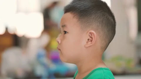 Little boy looking to the camera Stock Footage 158716334