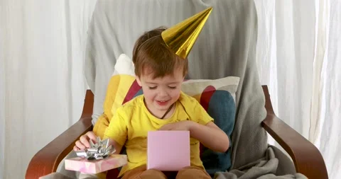 Little boy is looking forward to discovering given gift Stock Footage 139189542