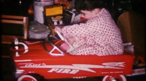 Little boy loves his pedal car Christmas gift 1950s vintage film home movie 2187 Stock Footage