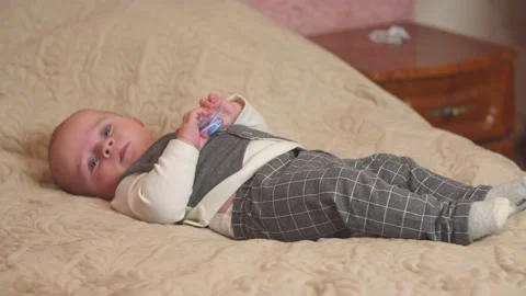 Little boy lying on the bed Stock Footage 146831575