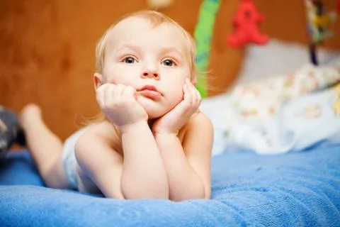 Little boy lying on the sofa Stock Photos