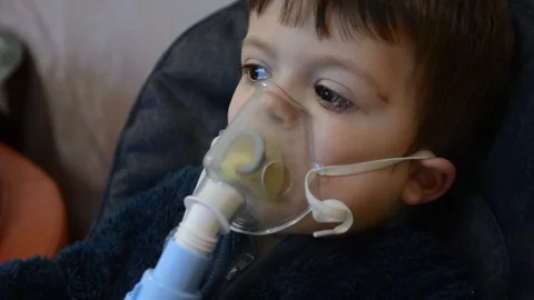 Little boy make inghalation in room with low light Video stock 123372004