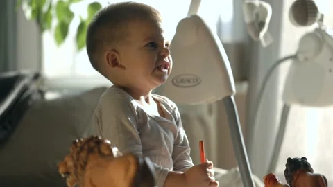 Little boy making angry face while he is drawing at home. Upset boy Stock Footage 165845010