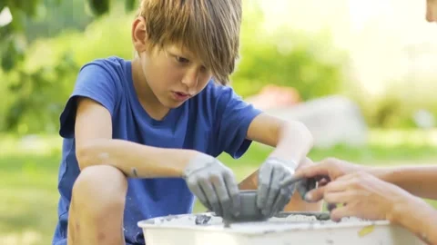 Little boy making ceramic pot on the pottery class. Child working with clay Stock Footage 158326367