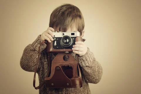 Little boy with an old camera Stock Photos
