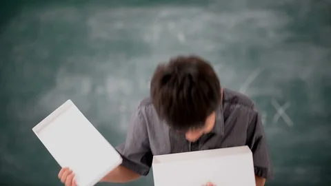 Little boy open empty box in the classroom Stockbeeldmateriaal 105273141