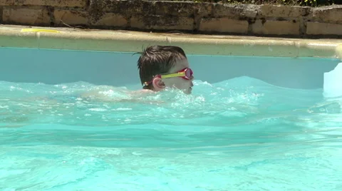 Little Boy In Outside Pool Learning To Swim Video stock 67150066