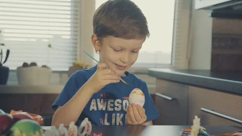 Little boy painting easter eggs Stock Footage 126284087