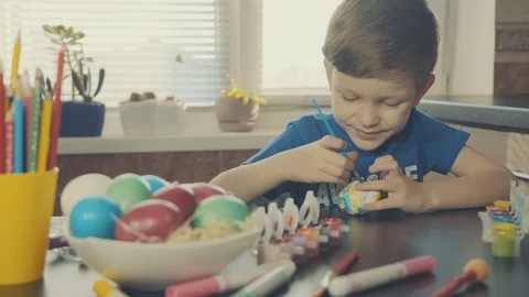 Little boy painting easter eggs Stock Footage 126284090